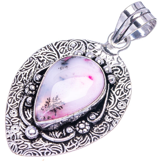 Ornate silver-tone pendant with pink dendritic opal teardrop cabochon center