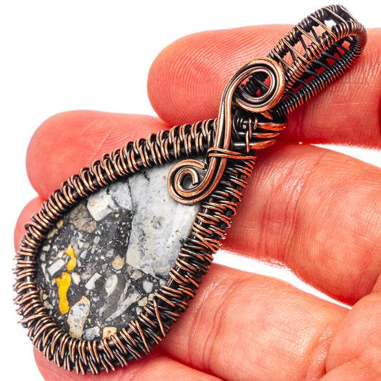 Oxidized copper wire wrap pendant detail with teardrop jasper stone and spiral bail