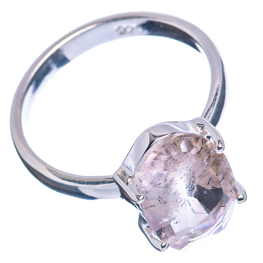 Sterling silver ring with oval faceted clear gemstone and four-prong halo-style bezel