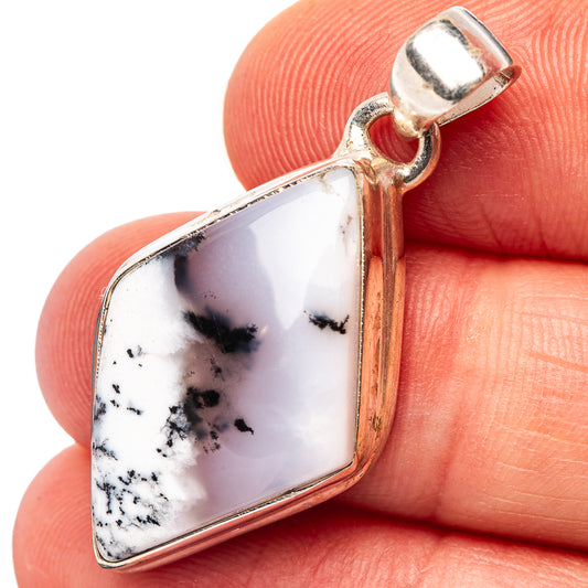 Dendritic opal pendant detail: white stone with black dendrites in silver bezel and bail