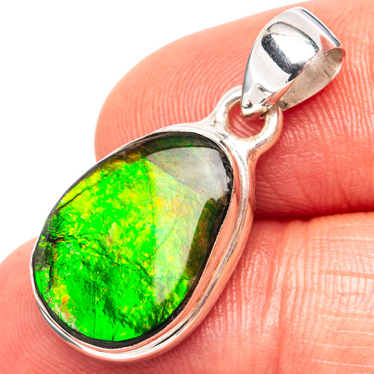 Oval ammolite pendant in polished .925 sterling silver bezel with hinged bail