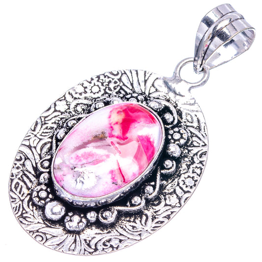 German silver oval opal pendant with pink dendritic stone and decorative filigree bezel