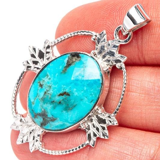 Oval turquoise pendant in .925 sterling silver ornate bezel with top bail