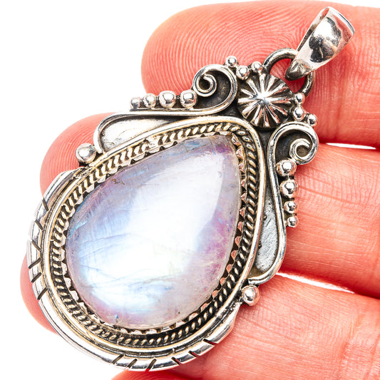 Teardrop rainbow moonstone pendant in .925 sterling silver with ornate raised frame