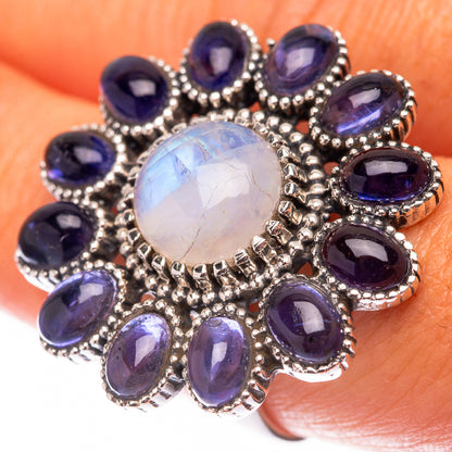 Sterling silver ring with round rainbow moonstone and oval blue-violet side stones