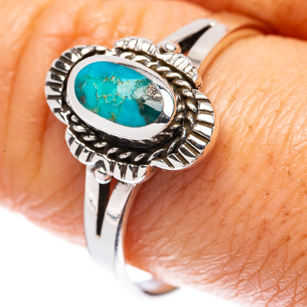 Sterling silver turquoise oval cabochon ring with engraved bezel and rope-style border
