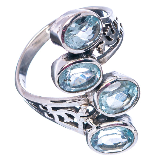 Sterling silver ring with three oval faceted blue topaz stones and ornate side cutouts