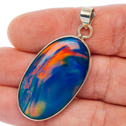 Sterling silver teardrop opal pendant with bezel-set multicolor iridescent stone