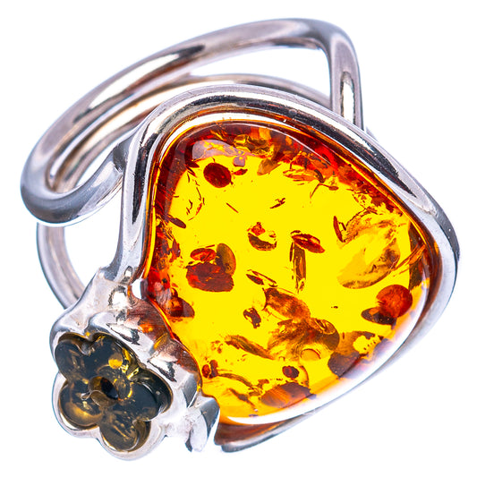 Sterling silver ring with oval amber cabochon and floral side detail
