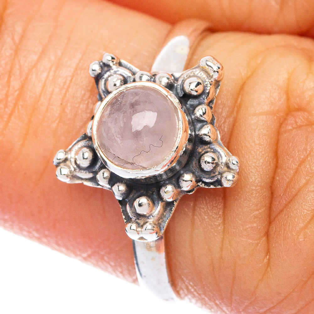 Dainty sterling silver ring with rose quartz oval cabochon and ornate setting