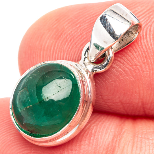 Sterling silver emerald pendant with green round cabochon and side view bail