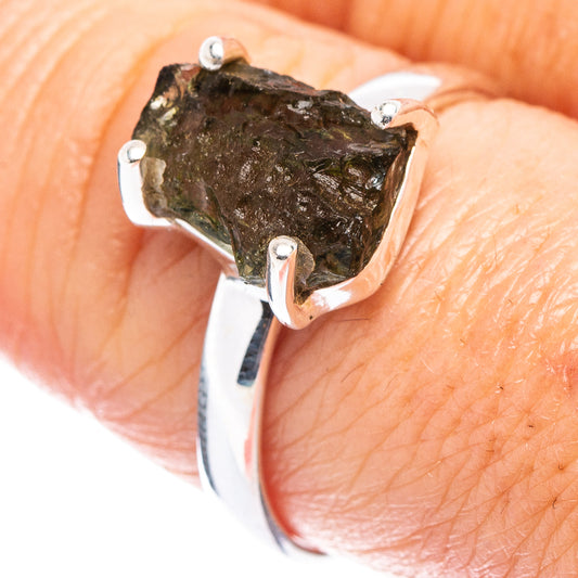 Sterling silver moldavite ring with irregular green gemstone, open prong setting