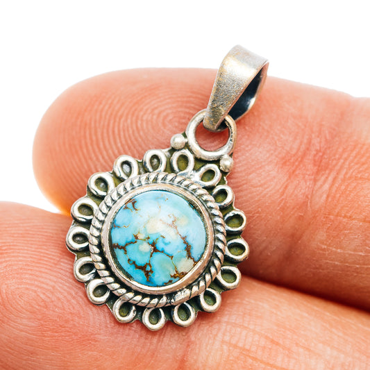 Round turquoise cabochon pendant with ornate .925 sterling silver bezel and bail