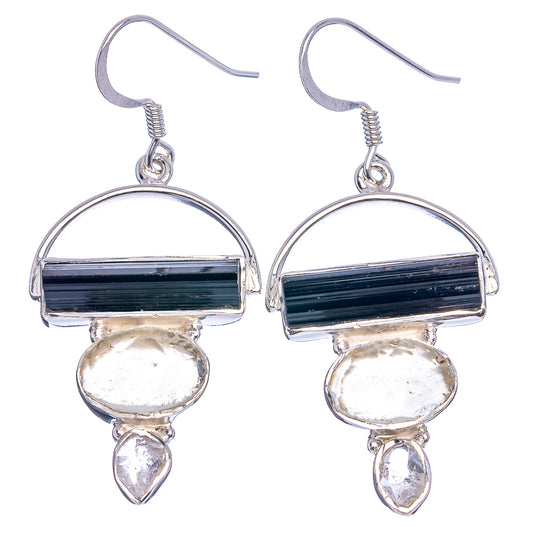 Sterling silver dangle earrings showing black tourmaline, round pale stones, and drops