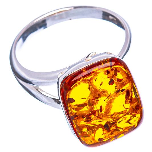 Sterling silver adjustable ring with amber cushion stone bezel.
