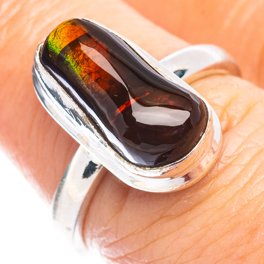 Sterling silver ring with oval fire agate cabochon, dark red-orange rainbow sheen