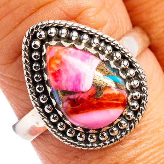 Sterling silver ring with oval pink, purple, and turquoise cabochon stone
