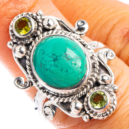 Turquoise oval gemstone ring in .925 sterling silver with peridot accents, ornate setting