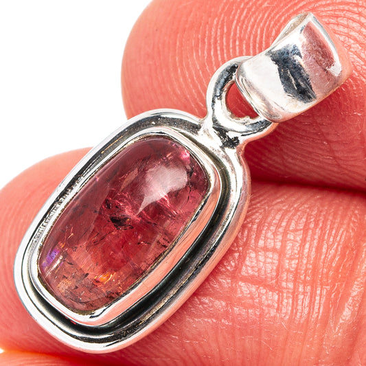 .925 sterling silver pendant with oval pink tourmaline, close-up view.