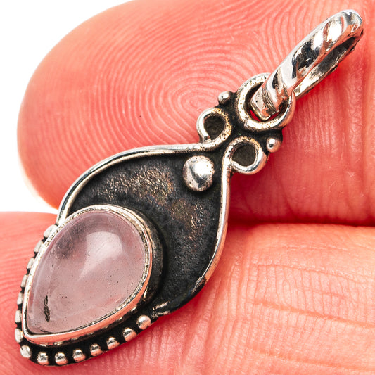 Rose quartz pendant, oval pink stone in .925 sterling silver ornate setting