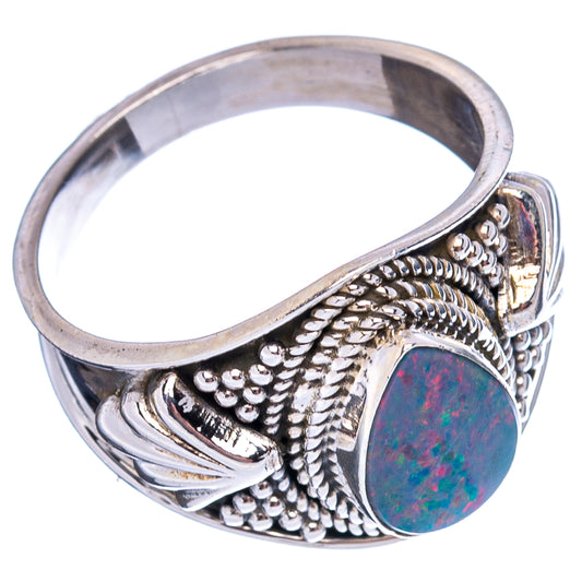 Sterling silver opal ring, oval blue-red stone on textured side band with raised details