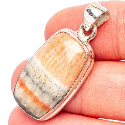 Sterling silver pendant with oval orange-and-gray celestobarite gemstone in bezel