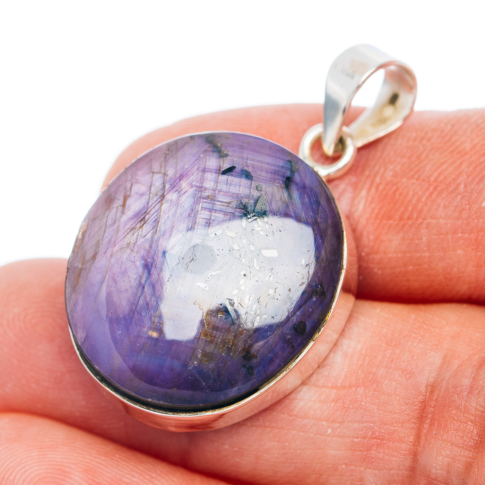 Sterling silver pendant with oval purple star-stone cabochon and top loop
