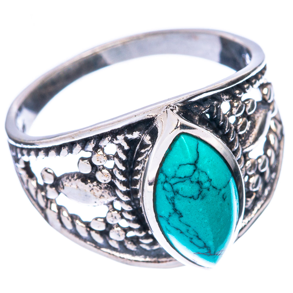 Sterling silver ring with oval turquoise cabochon and ornate cutout pattern