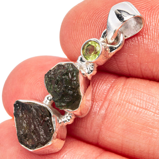 Sterling silver pendant with round peridot and rough dark green moldavite stones