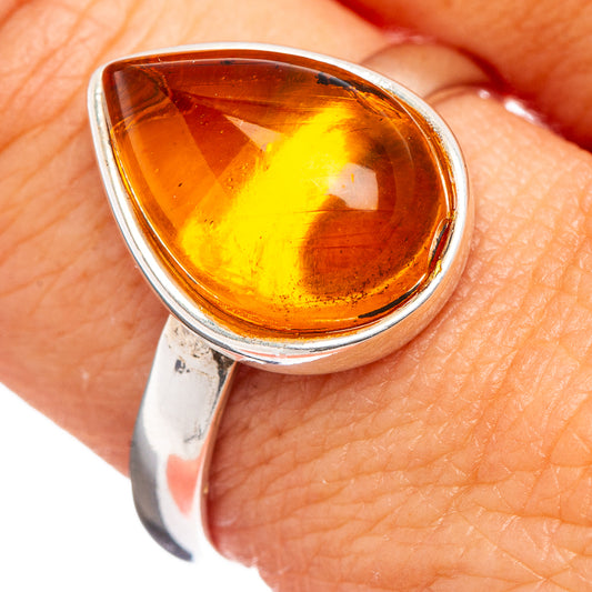 Amber teardrop cabochon ring with .925 sterling silver band, size 10