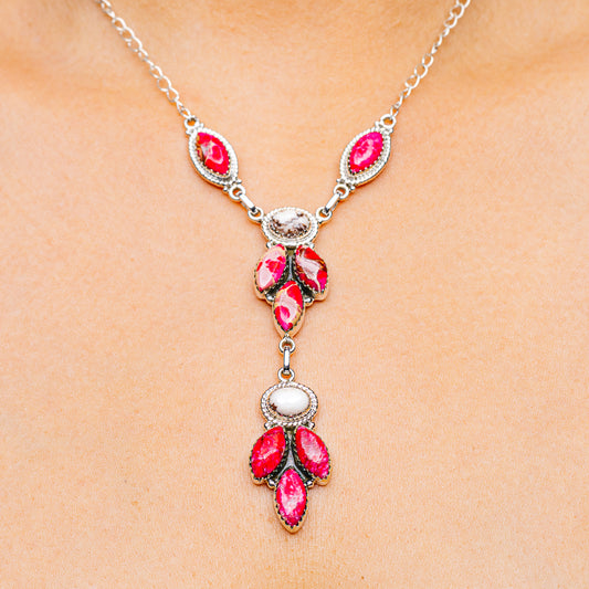 Sterling silver necklace with pink-red teardrop gemstone charms and drop pendant