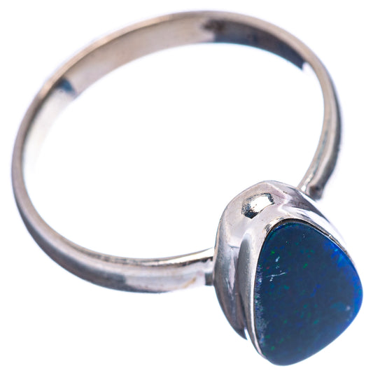 Sterling silver opal ring with oval blue opal in raised bezel, side view