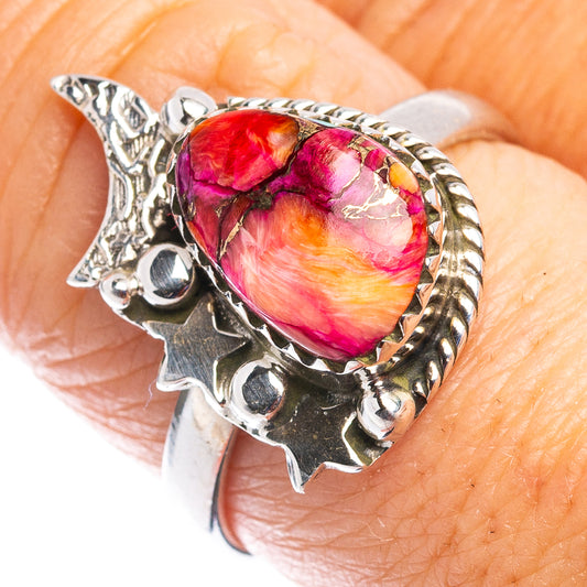 Sterling silver oval gemstone ring on hand view, with openwork star accents