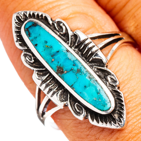 Turquoise oval sterling silver ring with engraved split-shank and bezel-set gem
