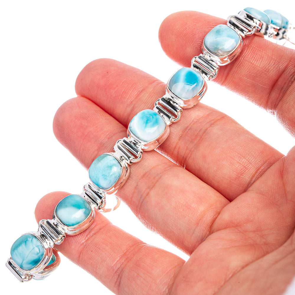 Larimar bracelet close-up of blue oval stones in silver bezel settings