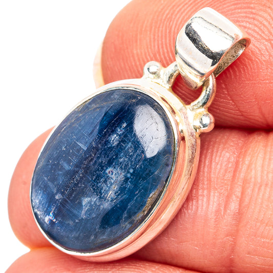 Sterling silver oval kyanite pendant with blue stone bezel and bail
