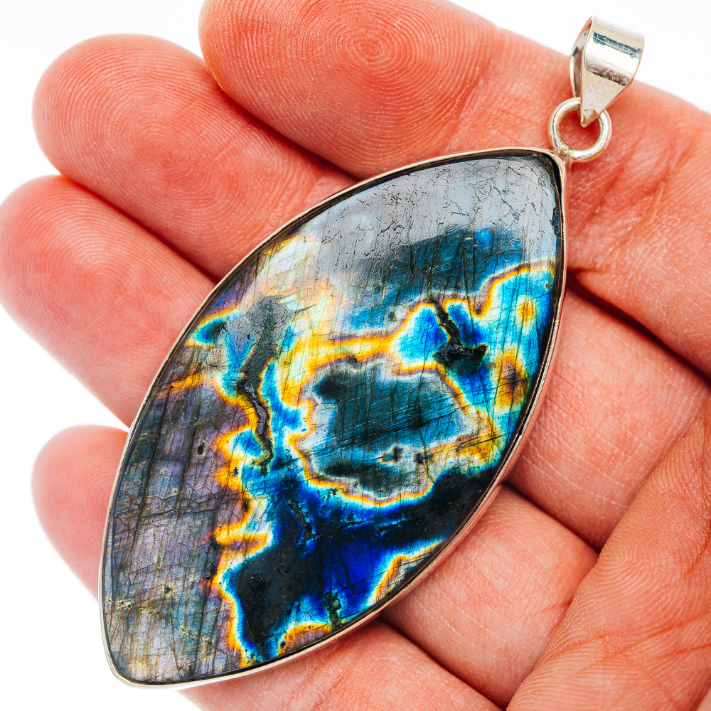 Sterling silver spectrolite pendant with blue and gold teardrop stone