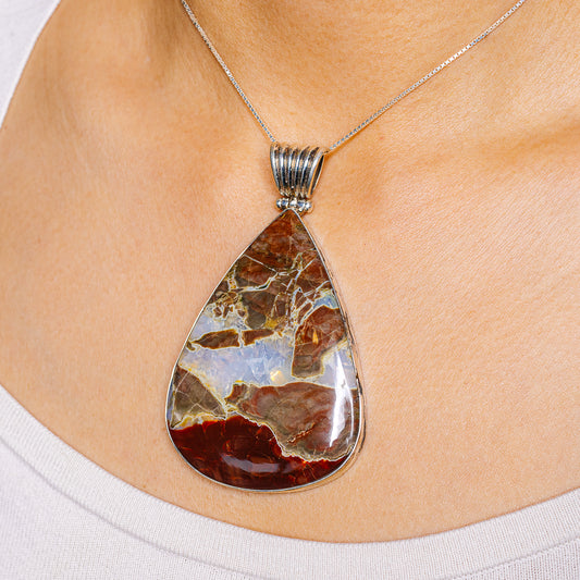 Teardrop jasper pendant with .925 sterling silver bail, blue and red stone