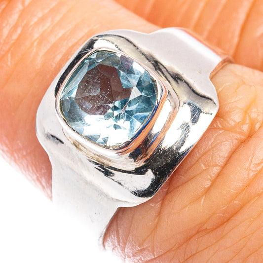 Sterling silver ring with oval blue topaz gemstone bezel setting