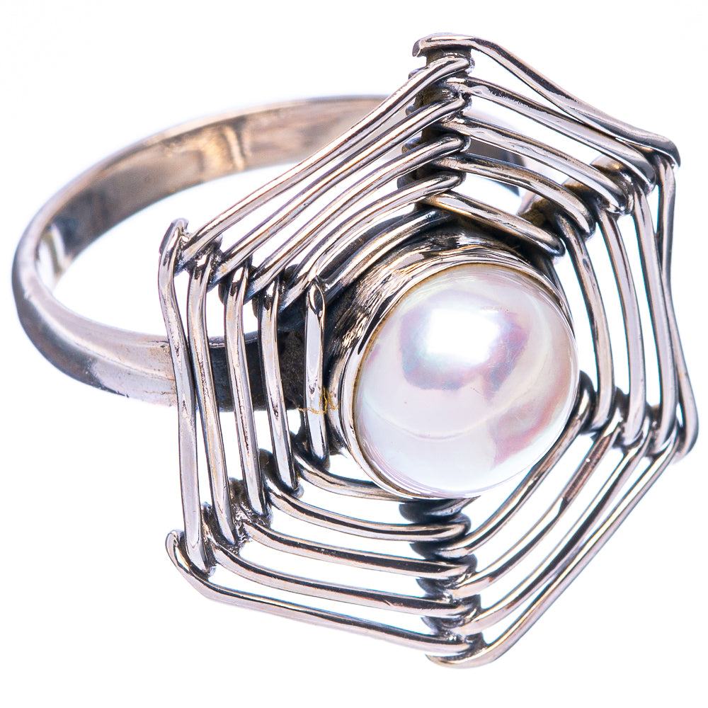 Sterling silver ring featuring a round cultured pearl in ribbed frame