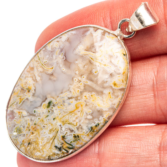 Silver-plated moss agate pendant with oval cabochon and bail, gold-and-green veining