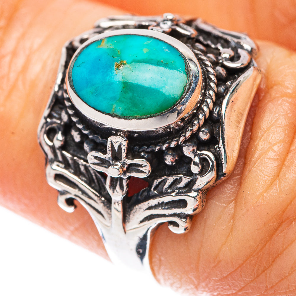 Sterling silver turquoise ring with oval cabochon and ornate floral filigree bezel