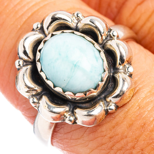 Sterling silver ring with bezel-set sky-blue larimar and decorative scalloped band