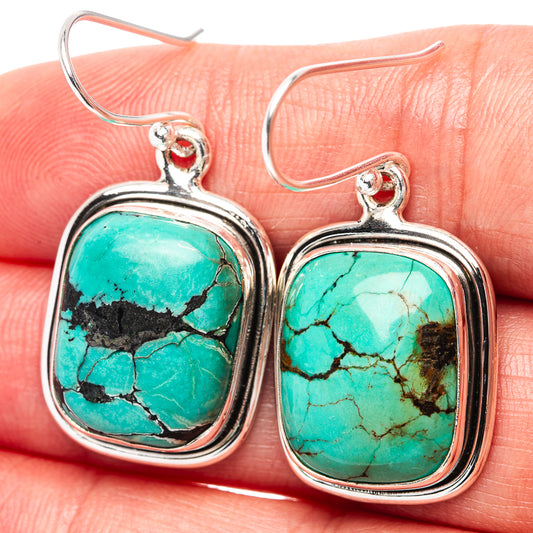 Turquoise stone drop earrings in .925 sterling silver, square frames with black matrix.