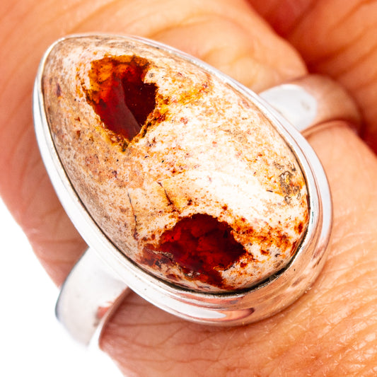 Oval fire opal ring with red-brown stone in .925 sterling silver band, size 8.75