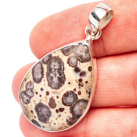 Teardrop jasper pendant in .925 sterling silver bezel, speckled dark stone pattern.