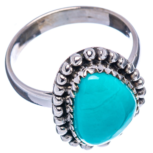 Sterling silver turquoise ring, oval cabochon with raised beaded bezel on band