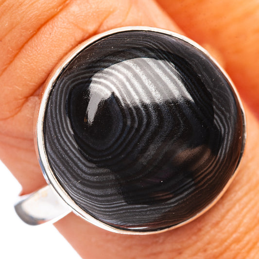 Size 10 .925 sterling silver ring with round black psilomelane cabochon in bezel.