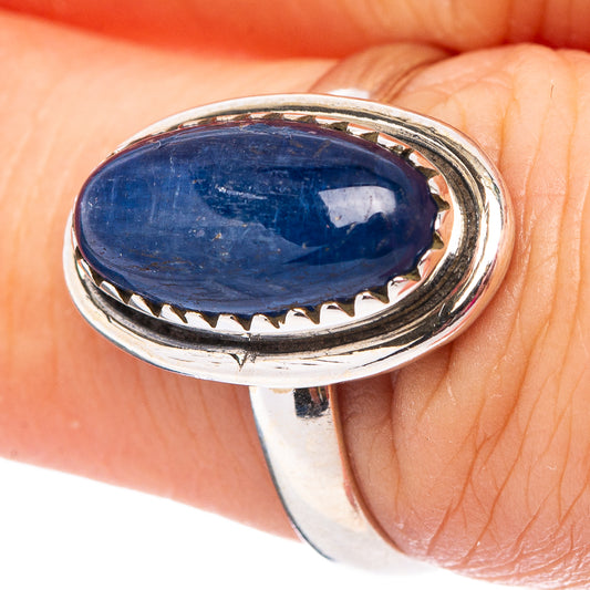 Sterling silver oval kyanite ring with blue cabochon stone, bezel and serrated edge