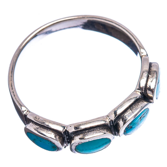 Sterling silver ring band with three turquoise oval cabochon settings, side view